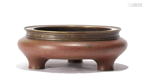 A CHINESE BRONZE TRIPOD CENSER