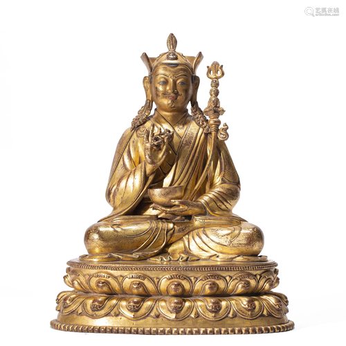 A TIBETAN BRONZE-GILT PADMASAMBHAVA