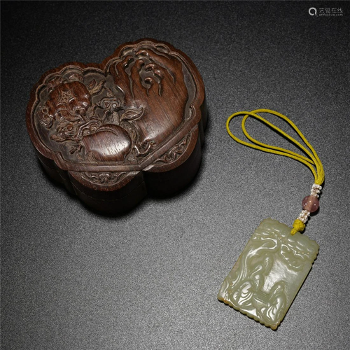 A CHINESE CARVED YELLOW JADE PENDANT