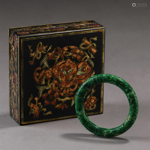 A Chinese Carved Jadeite Bangle