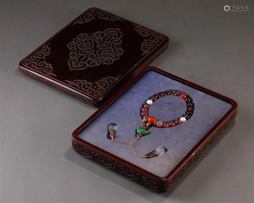 A Chinese Ruby Prayer Bead with Box