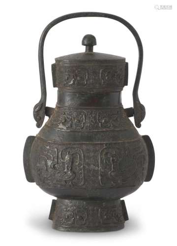 A CHINESE ARCHAISTIC BRONZE LIDDED WINE VESSEL, YOU SONG DYN...