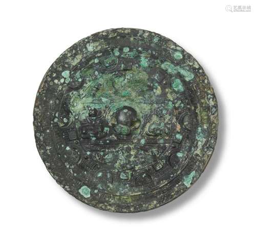 A CHINESE CIRCULAR BRONZE MIRROR HAN DYNASTY (202BC-220AD) O...