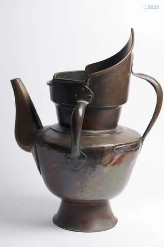 A LARGE INSCRIBED TIBETAN COPPER MONK'S CAP EWER 17TH/18...