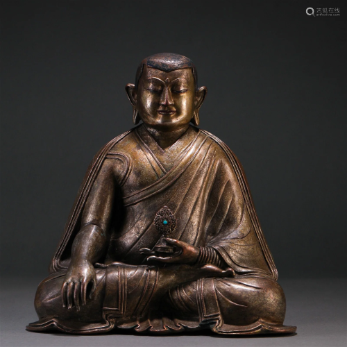 A Chinese Bronze Figure of Master