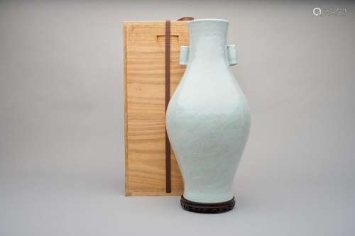 A white-glazed olive-shaped vase Qianlong six-character unde...