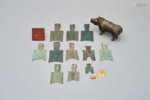 A group of archaic or archaistic bronze and gold artifacts t...