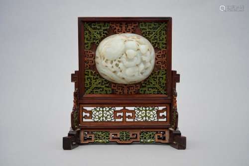 A table screen inlaid with a pale celadon jade plaque Qing d...