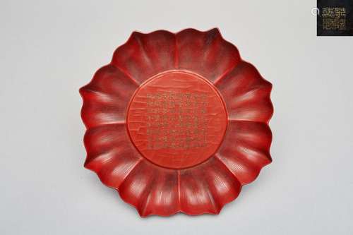 A red lacquer 'lotus' plate Qianlong four-character incised ...