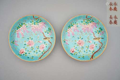 A pair of turquoise ground famille rose enamelled plates Yon...