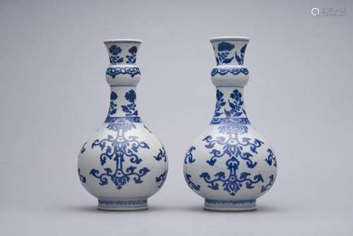 A pair of blue-and-white garlic-neck bottle vases Kangxi per...