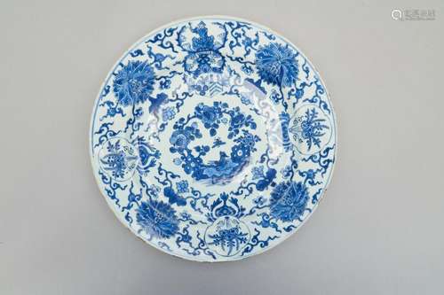 A large blue and white armorial dish for the Dutch market Ka...