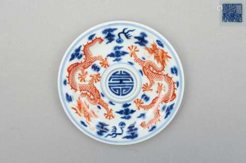 A blue-and-white and iron-red enamelled 'dragon' saucer Jiaq...