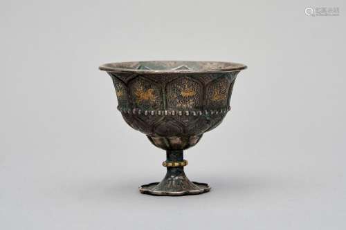 A Tang-style petal-lobed parcel-gilt silver stem cup