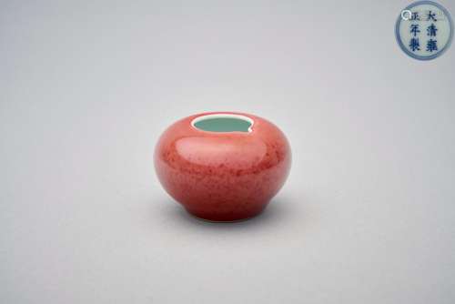 A pinkish-red glazed water pot Yongzheng six-character under...