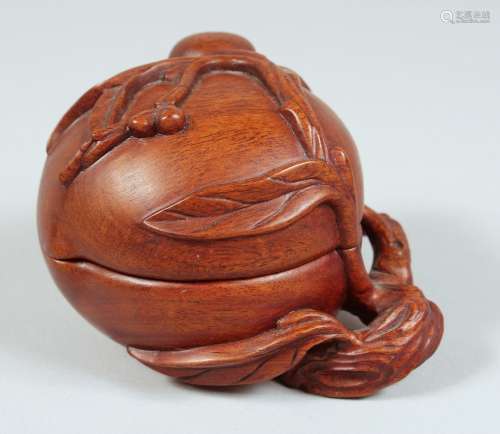 A CHINESE CARVED HARDWOOD PEACH FORM BOX AND COVER, with car...