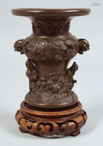 A SMALL JAPANESE BRONZE VASE with hardwood stand, the vase r...