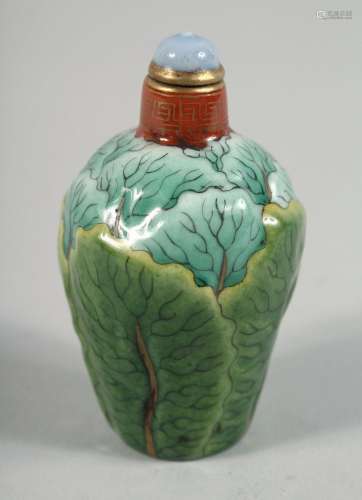 A CHINESE PAK CHOI FORMED PORCELAIN SNUFF BOTTLE AND STOPPER...