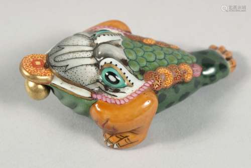 A CHINESE AQUATIC BEAST FORMED PORCELAIN SNUFF BOTTLE AND ST...
