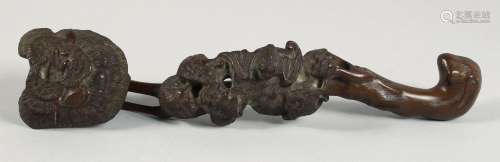 A CHINESE CARVED WOOD RUYI SCEPTRE, of naturalistic form and...