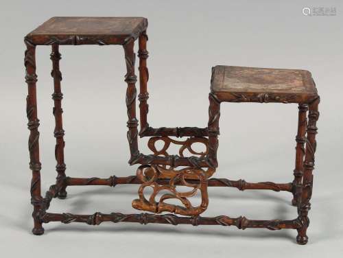 A CHINESE 19TH CENTURY HARDWOOD TWO TIER STAND, possibly hua...