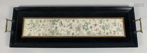 A CHINESE EMBROIDERED SILK TEXTILE, framed within a two hand...