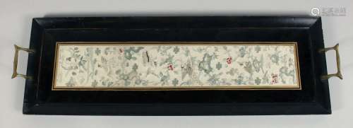 A CHINESE EMBROIDERED SILK TEXTILE, framed within a two hand...