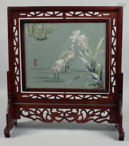 A LARGE CHINESE WOODEN TABLE SCREEN with embroidered panel d...