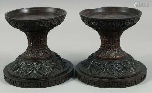 A PAIR OF 19TH CENTURY ANGLO INDIAN CARVED HARDWOOD PEDESTAL...