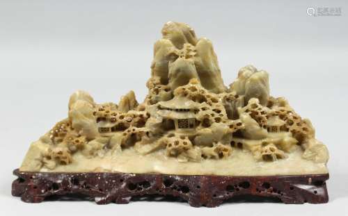 A GOOD CHINESE SOAPSTONE CARVING of a landscape scene with b...