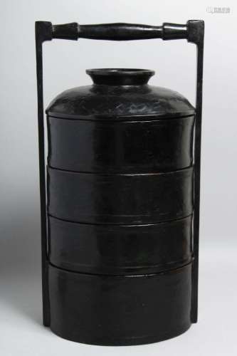 A CHINESE BLACK LACQUERED FOOD CARRIER, containing three det...