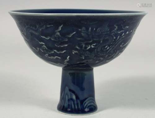 A CHINESE SACRIFICIAL BLUE GLAZE PORCELAIN STEM CUP, the ext...