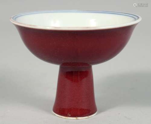 A SMALL CHINESE RED GLAZE PORCELAIN STEM CUP, the interior w...