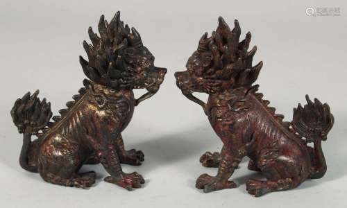 A PAIR OF CHINESE BRONZE MYTHOLOGICAL BEASTS, each with trac...