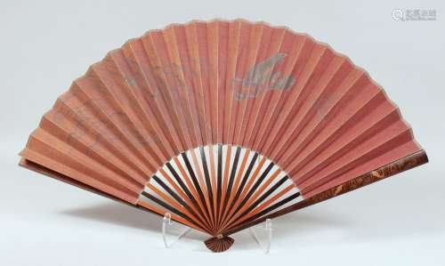 A JAPANESE LACQUERED WOOD FOLDING FAN, the lacquered guards ...