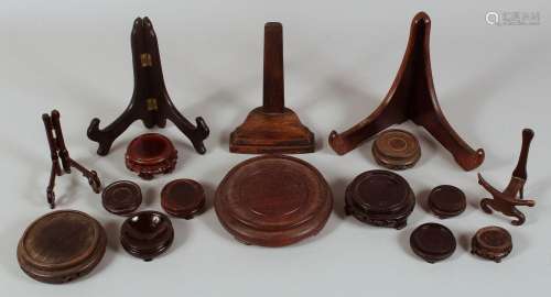 A QUANTITY OF CHINESE HARDWOOD STANDS, various styles and si...