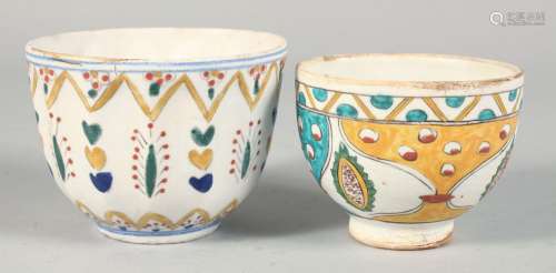 TWO TURKISH KUTAHYA POTTERY BOWLS, each painted with decorat...