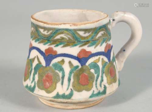 A TURKISH KUTAHYA POTTERY WINE CUP, decorated with foliate d...