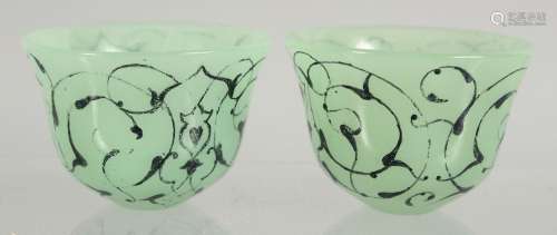 A SMALL PAIR OF ISLAMIC GLASS CUPS, 6cm diameter.