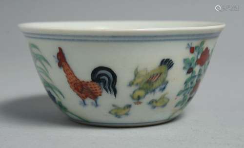 A CHINESE DOUCAI PORCELAIN CHICKEN CUP, the base six-charact...