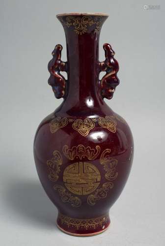 A CHINESE OX BLOOD GLAZE TWIN HANDLE VASE, the body with gil...