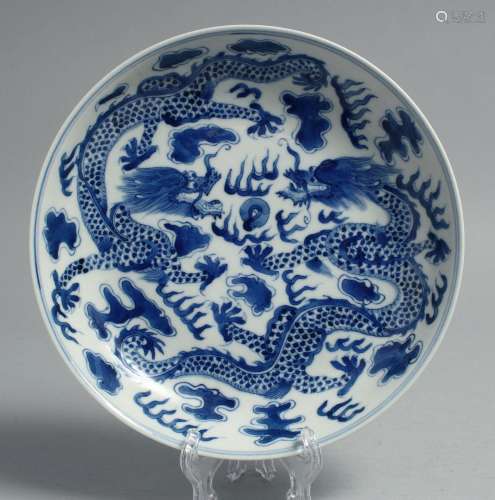 A CHINESE BLUE AND WHITE PORCELAIN DISH, painted with dragon...