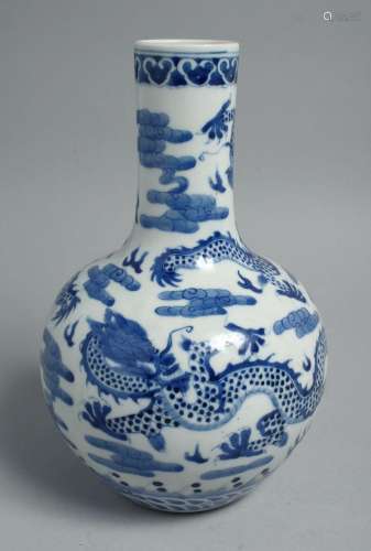 A CHINESE BLUE AND WHITE PORCELAIN BOTTLE VASE, painted with...