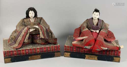 A PAIR OF JAPANESE CARVED AND LACQUERED WOOD MARRIAGE DOLLS,...