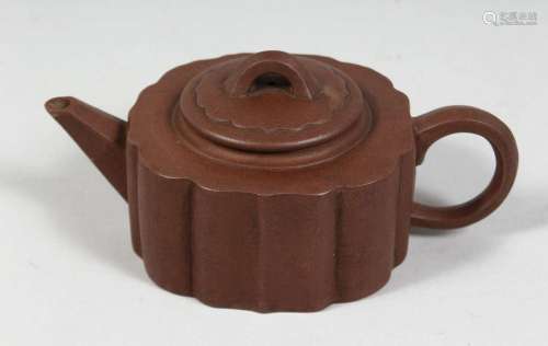 A CHINESE YIXING TEAPOT with impressed mark to inner lid and...