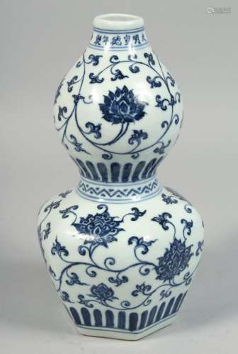 A CHINESE BLUE AND WHITE PORCELAIN DOUBLE GOURD VASE decorat...