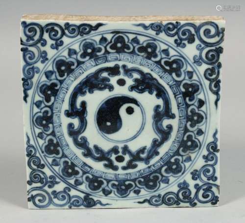 A CHINESE BLUE AND WHITE TEMPLE TILE with decorative motif d...