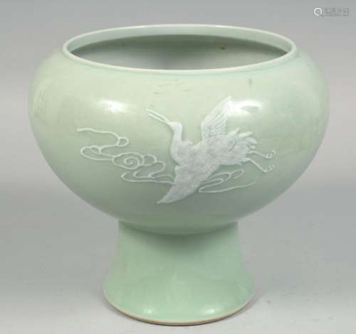 A LARGE CHINESE CELADON PEDESTAL BOWL with raised decoration...