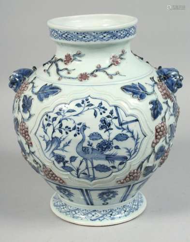 A CHINESE BLUE, WHITE AND RED PORCELAIN TWIN-HANDLED VASE wi...