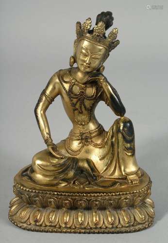 A THAI GILT BRONZE FIGURE OF A SEATED DEITY, 19.5cm high.